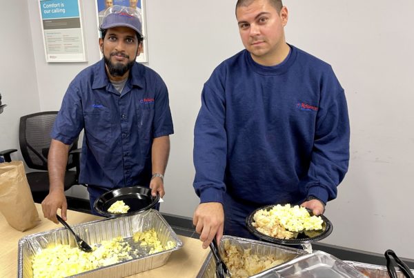 Ashwin Chandran and Jordan Bressette of Reliance Home Comfort enjoy their United Way kick off breakfast to commence the week-long United Way employee campaign at Reliance in Sarnia