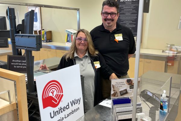 Niki Rivait and store Manager Jason Killingsworth prepare for their day to ask customers to donate $2, $5, or $10 at the till when paying for their LCBO purchases