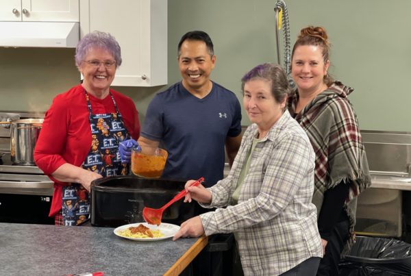 Carol Turner, Lehrend Reyes, Penny Hartnett, Lynnette VanLandeghem from New Beginnings, ABI, Stroke Recovery, a funded agency of the United Way prepare the first orders of their annual United Way Fundraising Spaghetti Lunch