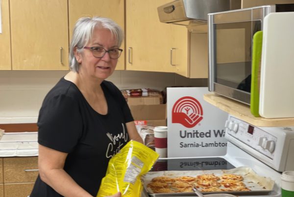 Sue Serratore, a five year volunteer with the school nutrition and breakfast program and Bluewater Health Retiree prepares the school snack for students at Pauline McGibbon public School in Sarnia